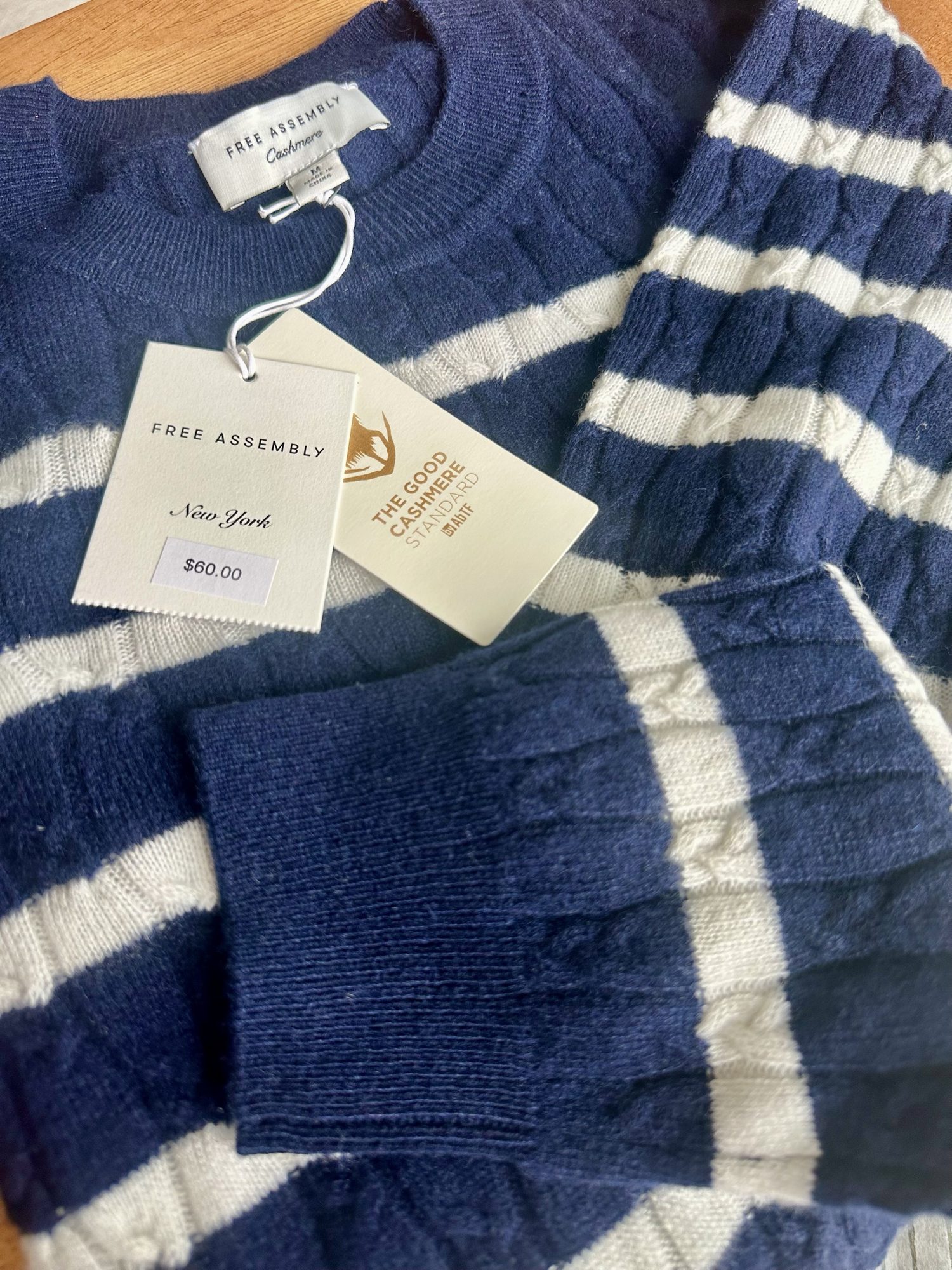 Navy-and-white striped Free Assembly cashmere sweater with its 0.00 price tag.