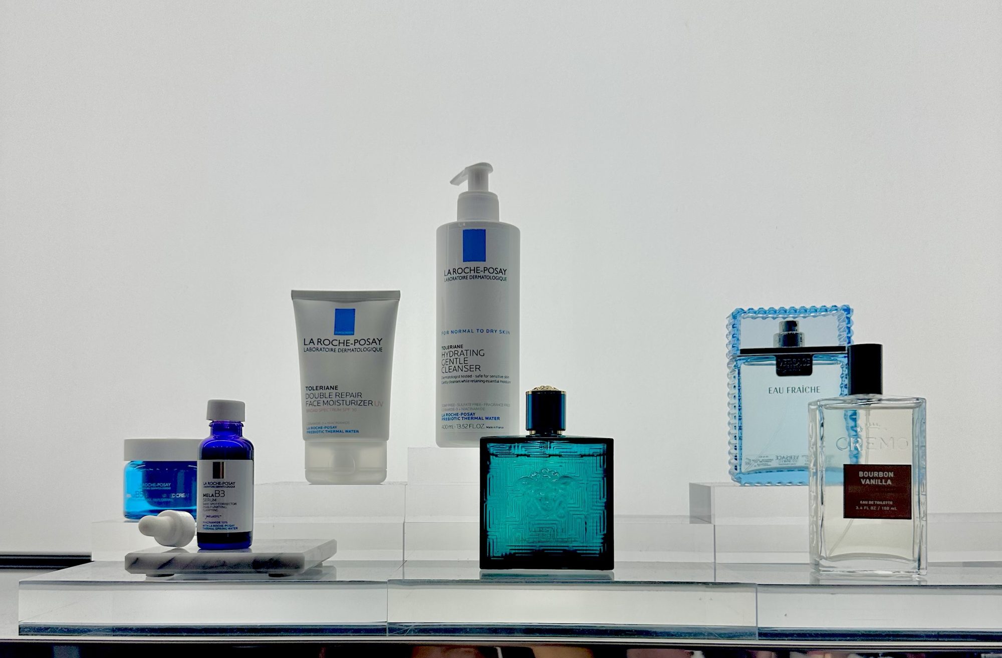 A beauty edit display at the pop-up: La Roche-Posay skincare alongside Versace and Cremo fragrances.